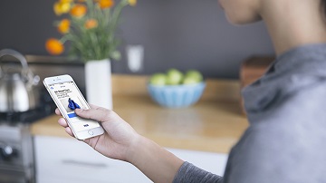 Person signing up for a loyalty programme for a small business in their area