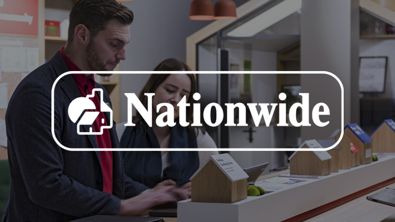 Nationwide logo overlying imagery of a woman and a man collaborating.