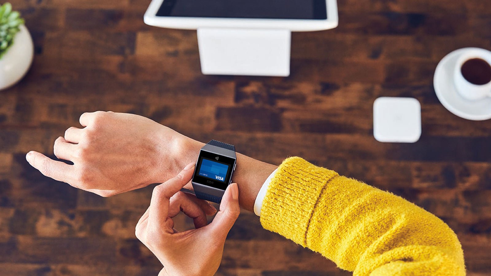 Person using the Visa digital wallet on their smart watch to make a payment